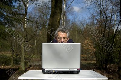 Senior man with laptop