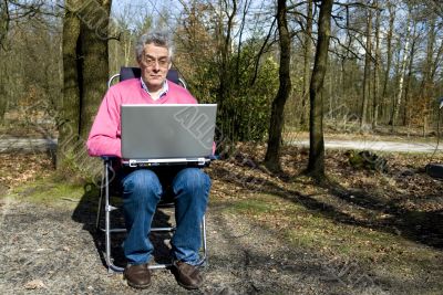 Senior man with laptop