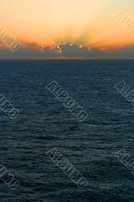 Sunset Over Stormy Sea