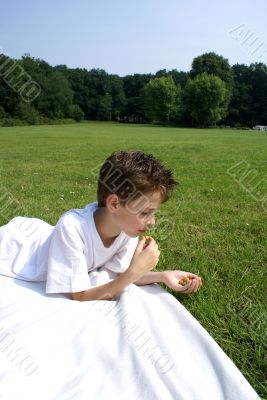 Boy eating olives.