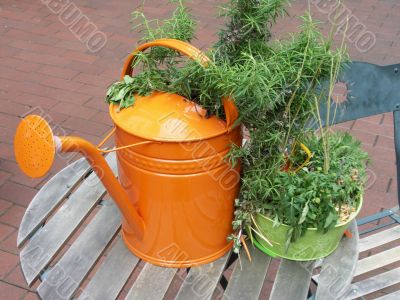 Orange watering can.
