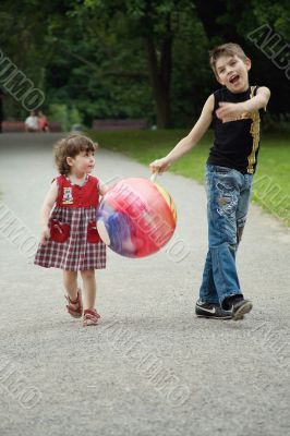 The brother and sister on walk in park