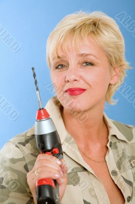 model  poses in studio with cordless drill