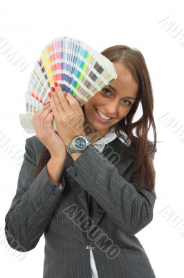 Business woman demonstrates palette of the paints