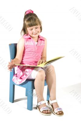 cute little girl is reading