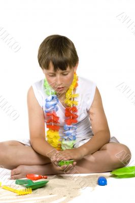 Boy plays with sand