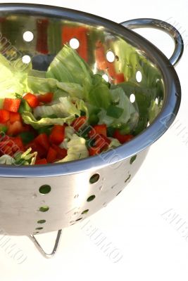 Salad in strainer.