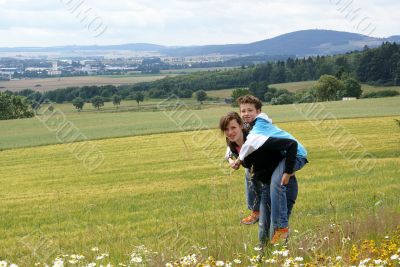 Boy on her back.