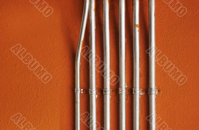 Pipes on an Orange Wall