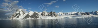 Panorama - Reflections of glacial icefalls and mountains