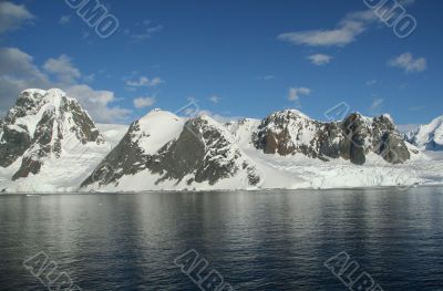 Reflections of glacial icefalls and mountains