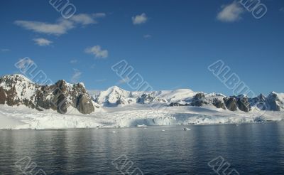 Reflections of glacial icefalls and mountains