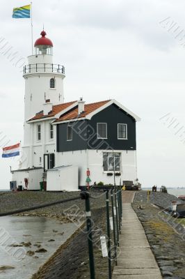lighthouse with 2 flags