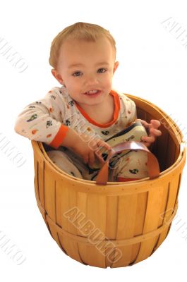 Boy sitting in basket