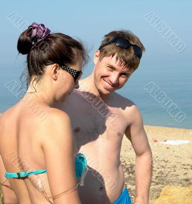 man and woman on the beach
