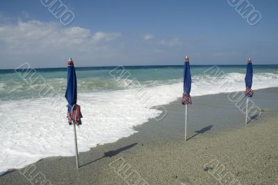 three blue parasols
