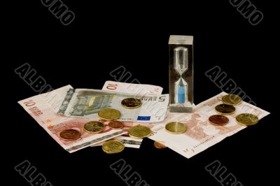 Euros and sand glass