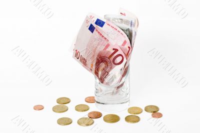 Euros in the glass isolated