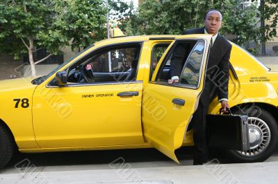Business Man Exiting Taxi
