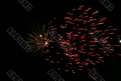 Night fireworks upon dark sky