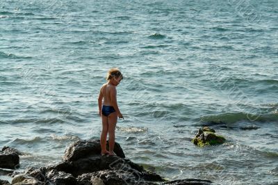 boy in sea waves