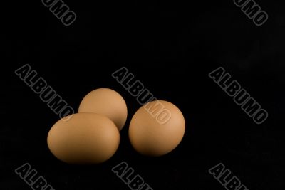 three eggs in black