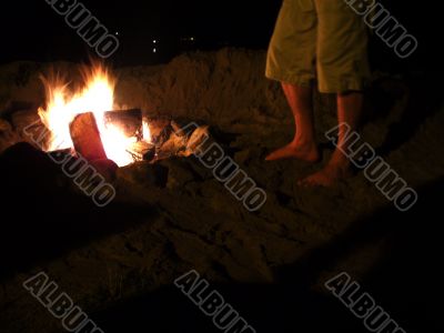 Feet of Man at Beach Side Bonfire