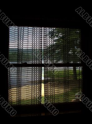 Landscape of Lake Through Cabin Curtains