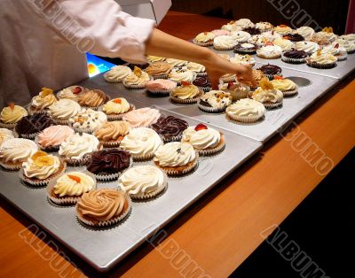 Baker Reaches For Cupcake
