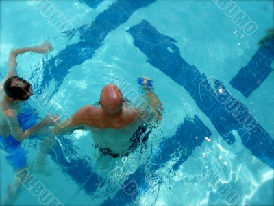 Swimmers in Summer Pool