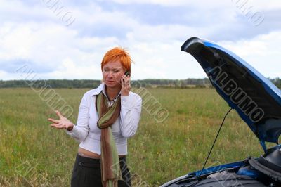 young woman with her broken car