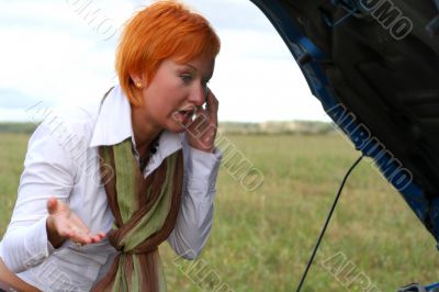 young woman with her broken car