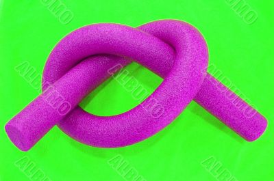 pink noodle on green