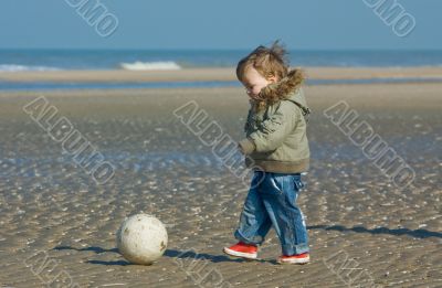 cute boy playing soccer