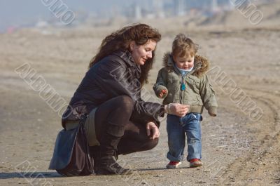 mother and cute boy on the beach