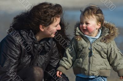 mother and cute boy on the beach