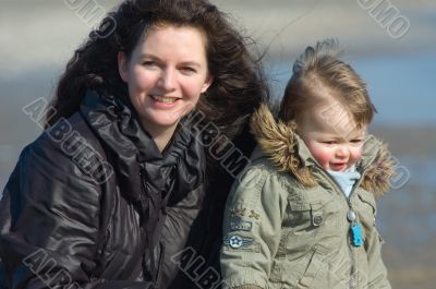 mother and cute boy on the beach