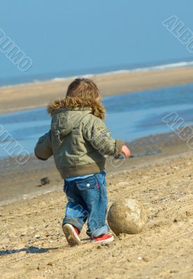 cute boy playing soccer
