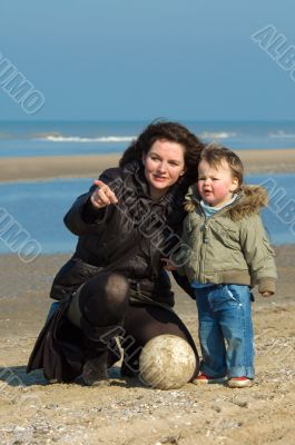 mother and cute boy on the beach