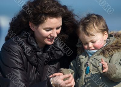 mother and cute boy on the beach