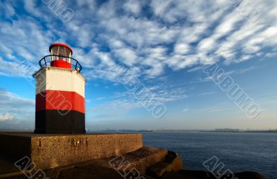 lighthouse with harbor view