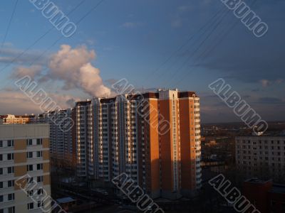 Kind from a window on evening city