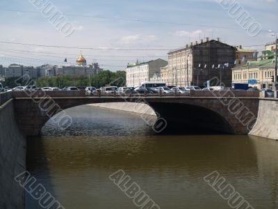 The bridge through the river in summer day