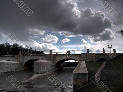 The bridge through the river in summer day