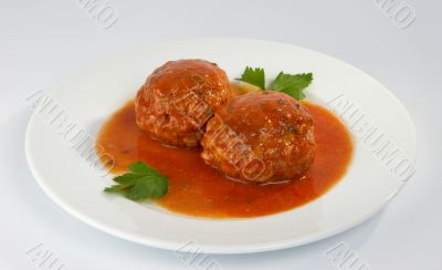 Meatballs with mushrooms in tomato sauce.