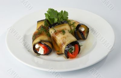 Fried eggplants with tomatoes and cheese.