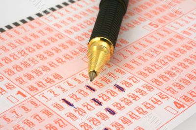 lottery ticket and pen