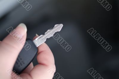 hand with car key