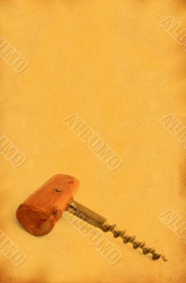 vintage corkscrew against stained old paper #2