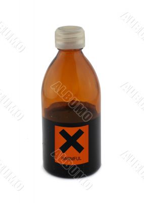 small glass bottle with harmful sign